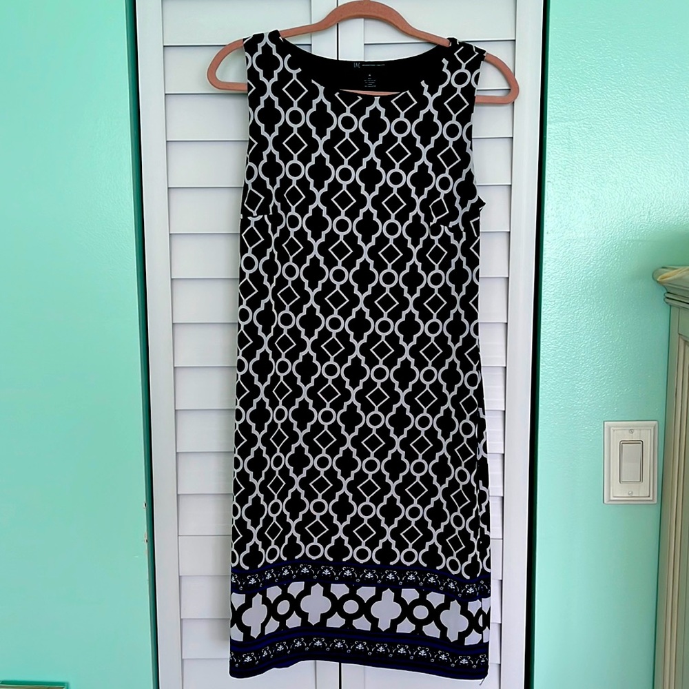 INC sleeveless A line pull on dress in black, white and some blue on bottom.